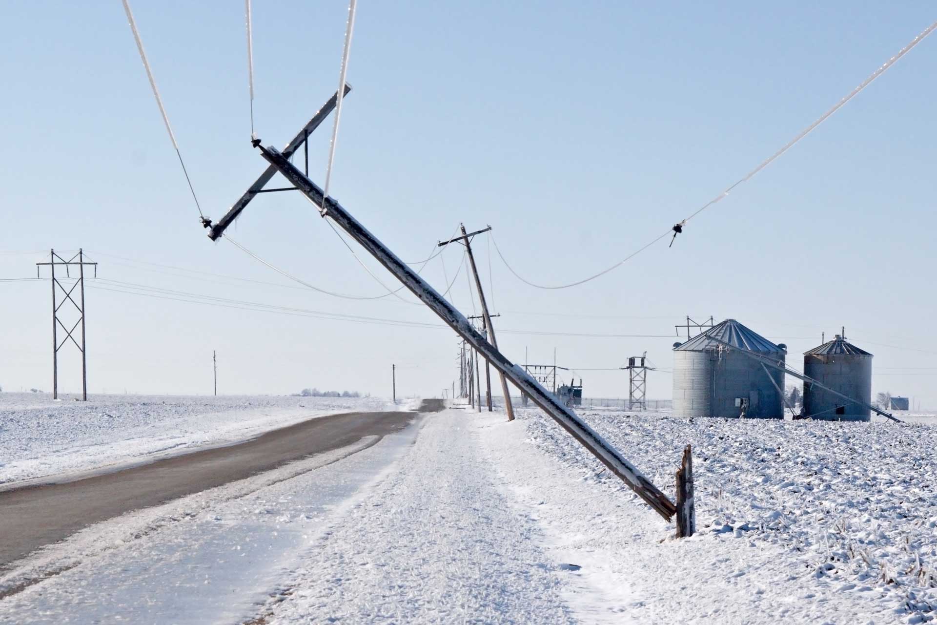 a series of power lines downed by ice and snow