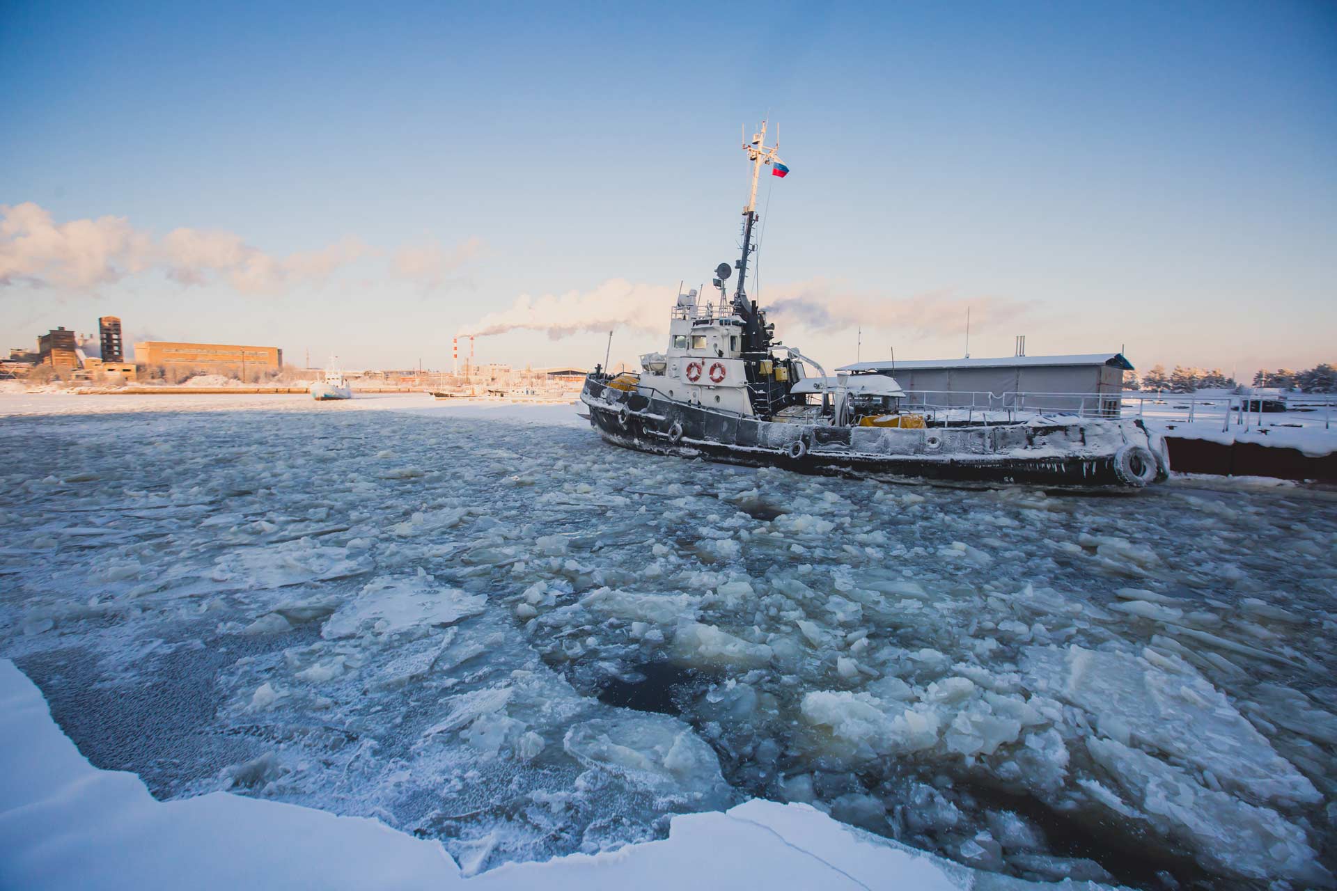 A boat surrounded by icy seas.